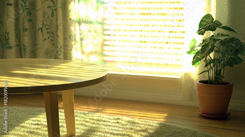 A round wooden coffee table sits on a textured rug next to a potted green plant by a window with blinds and patterned curtains, bathed in warm sunlight.