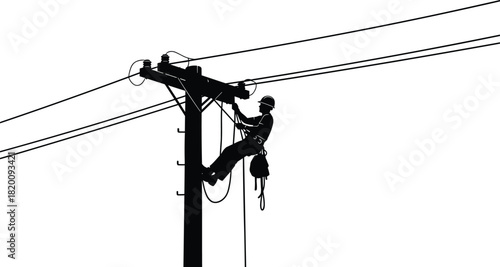 Electrical lineman silhouette working high on a wooden power pole connecting transmission lines against a white sky maintenance worker service industry professional.