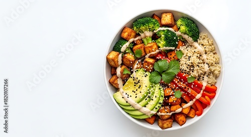 Top view of a vibrant buddha bowl with tofu and avocado, health concept