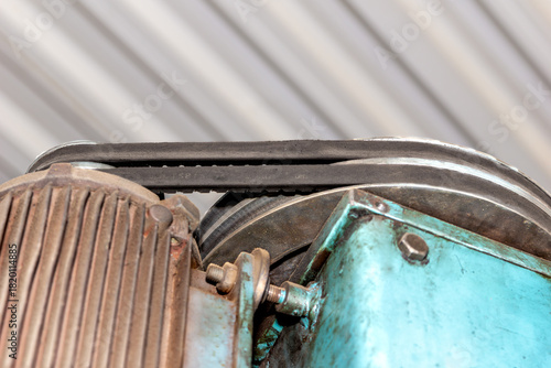 Dual V-belt drive transferring torque from electric motor to workshop machinery