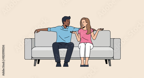 Happy multiracial couple sitting on sofa and talking.