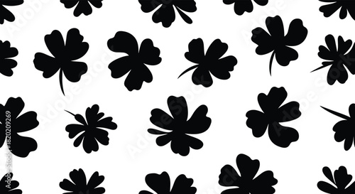 Minimalist seamless pattern of scattered black four-leaf clover silhouettes on a white background, symbolizing good luck for St. Patrick's Day designs.