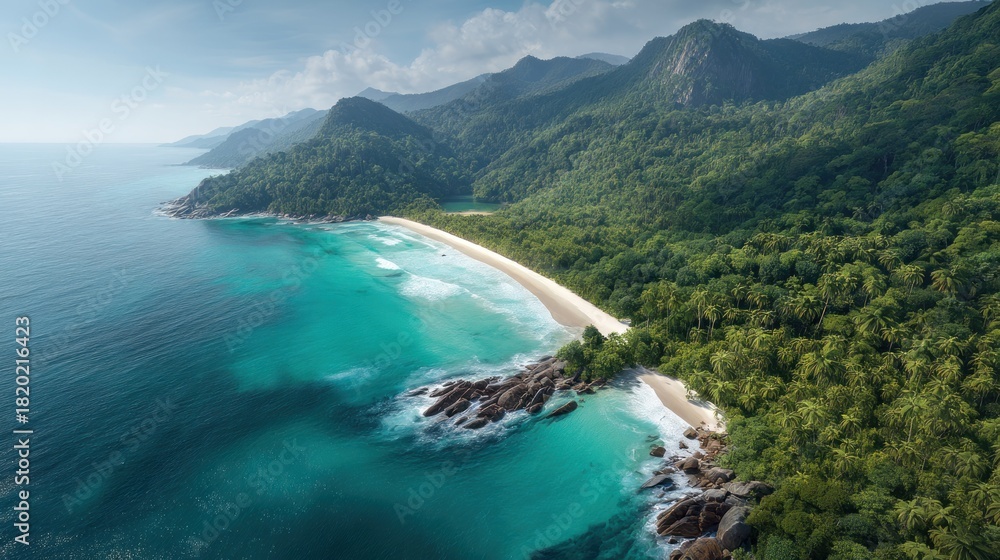 Naklejka premium A breathtaking aerial view of a pristine tropical beach with turquoise waters and lush greenery, featuring a sandy beach, rocky shoreline, and a mountainous backdrop under a clear blue sky.