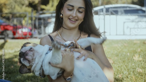 Woman Playing with a Happy Dog in the Park