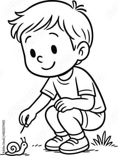Little boy gently touching a snail in the garden