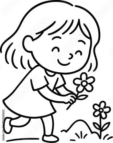 Little girl picking flowers in a field with a smile