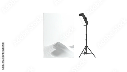 Studio setup Backdrop of sand dunes, light stand, and bright panel against a dark background