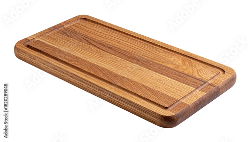Rectangular wooden cutting board with juice groove, isolated on black background