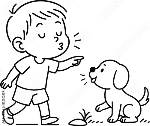 Boy scolding a misbehaving puppy for digging in the ground