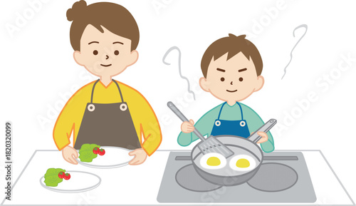 男の子と一緒に料理をする女性