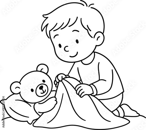 Little boy putting his teddy bear to bed with a blanket