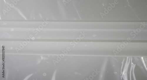 Abstract macro view of a clean, bright white plastic material surface showing detailed synthetic texture and seamless background design element ,structure ,industrial ,surface