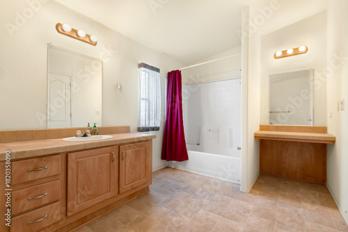 Wallpaper Mural A spacious bathroom featuring two sinks alongside a bathtub Torontodigital.ca