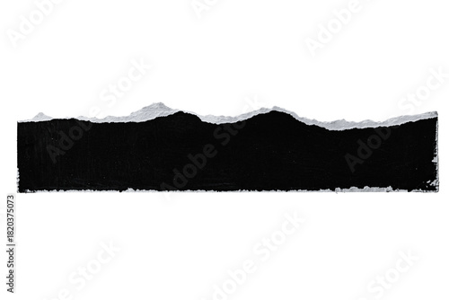 A black torn paper strip with jagged edges isolated on a solid black background space