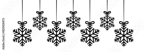 image of christmas snowflakes hanging on a white background