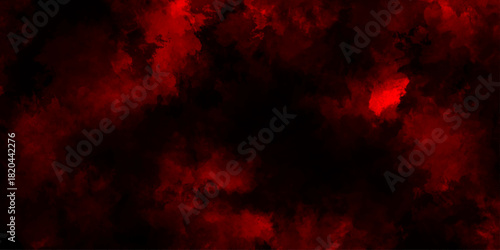 A dark dramatic background with intense red and black smoke-like clouds, creating a fiery, atmospheric effect. red grange powder explosion cloud on black background. red scary horror movie background.