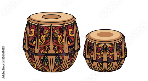 Two intricately designed Indian tabla drums sit isolated on white background.