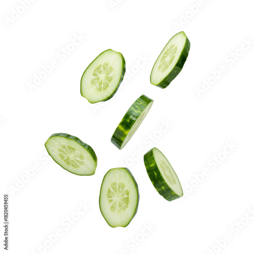 Floating cucumber slices with visible seeds and green skin, isolated on transparent background, emphasizing freshness and motion.