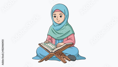 A young girl in hijab sits and reads a religious book with focused attention.