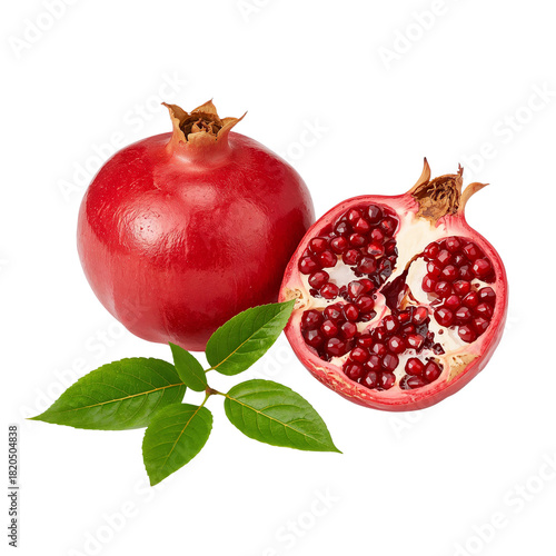 Fresh whole and half pomegranate with green leaves, studio shot