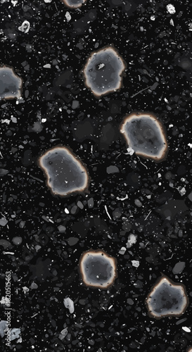 Abstract dark surface with irregular, luminous formations, showcasing a unique texture of grit and light, reminiscent of naturally occurring or auto-formed patterns on a rugged ground