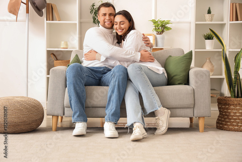 Happy young couple hugging ...