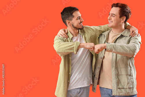 Male friends bumping fists ...