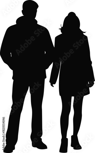 Silhouette of a couple standing closely together wearing winter clothing outdoors high quality