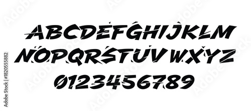 Dynamic alphabet with sharp cuts. Modern font design. Stylish typeface for creative projects. Bold letters and numbers.