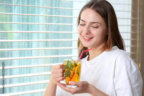 Young woman with ice tea ne...