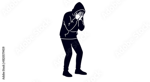 Person in hoodie hides face in hands, conveying distress or shame