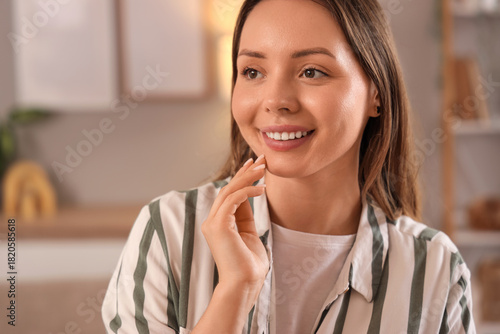 Dreamy young woman at home,...