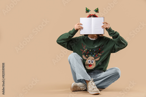 Young woman in Christmas he...