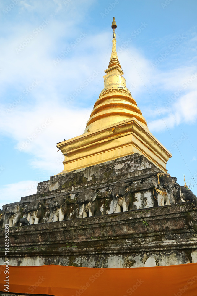 Fototapeta premium The Main Chedi of Wat Phra That Chang Kham Worawihan Temple, Mueang Nan District, Nan Province, Northern Thailand