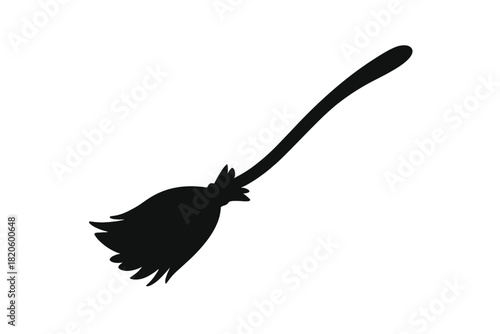 Black silhouette of a traditional witch's broomstick for Halloween flying