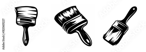 Three hand-drawn paintbrushes displayed artistically for creative projects and artistic applications