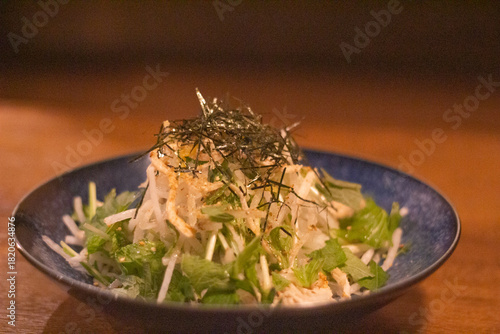 Photography Close up of vegetable salad with seaweed topping