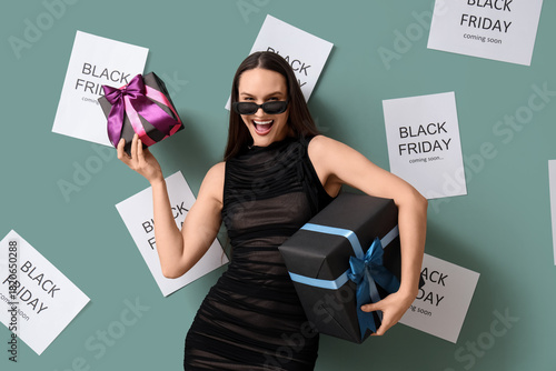 Excited woman holding black...