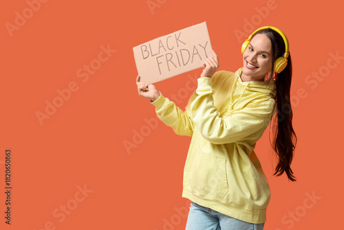 Happy young woman in headph...