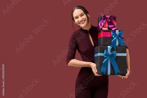 Happy young woman with gift...