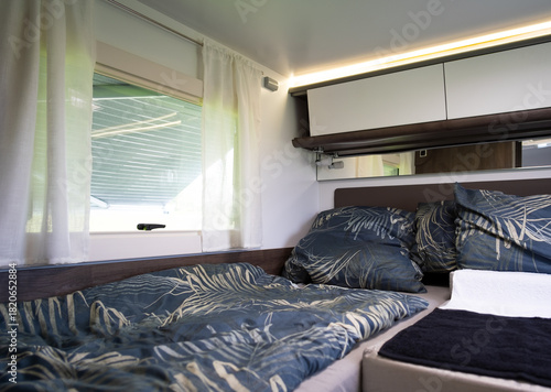 bedroom with bed in a camper van
