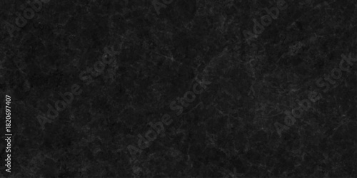 Black dark grunge stone texture with rough, natural wall surface background. uneven pattern resembling weathered black rock or charcoal. Panorama black canvas slate texture. blackboard background.