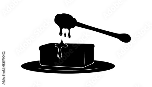 Sweet honey dripping from a dipper onto a block of butter on a plate