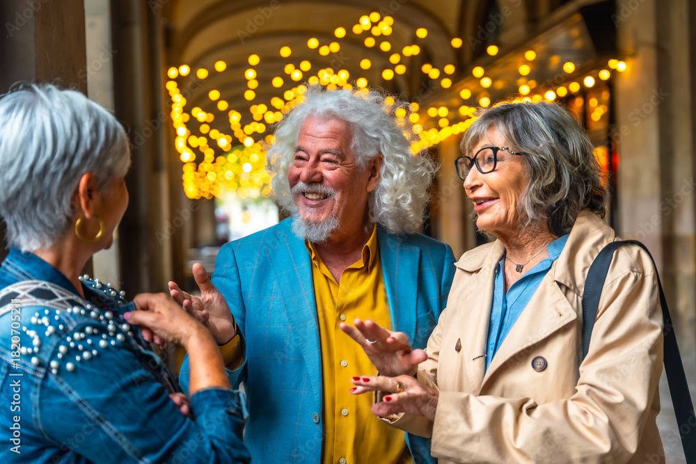 Fototapeta premium Seniors friends conversing outdoors enjoying active social life