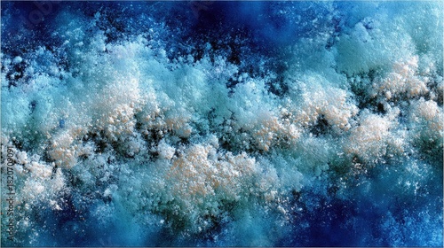 Fototapeta Naklejka Na Ścianę i Meble -  An abstract close-up of turbulent water with white foam and bubbles against a deep blue background, creating a dynamic and textured effect.