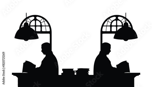 Two people working at a desk with lamps in a modern office setting