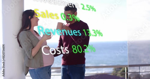 Expecting couple clinking mugs, man reaching and touching belly, finance terms overlaying scene