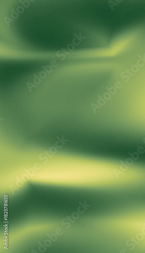 Soft green and yellow abstract background with a grainy texture and flowing light patterns