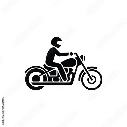 Silhouette of a person riding a motorcycle wearing a helmet