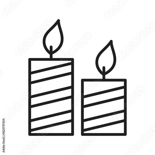 Two striped candles of different heights with flames